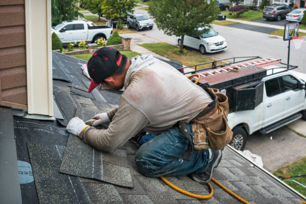Professional Roofing technician working in Spray, OR